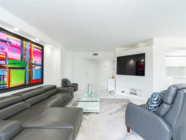 living room featuring visible vents and baseboards