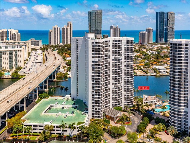 aerial view featuring a water view and a view of city