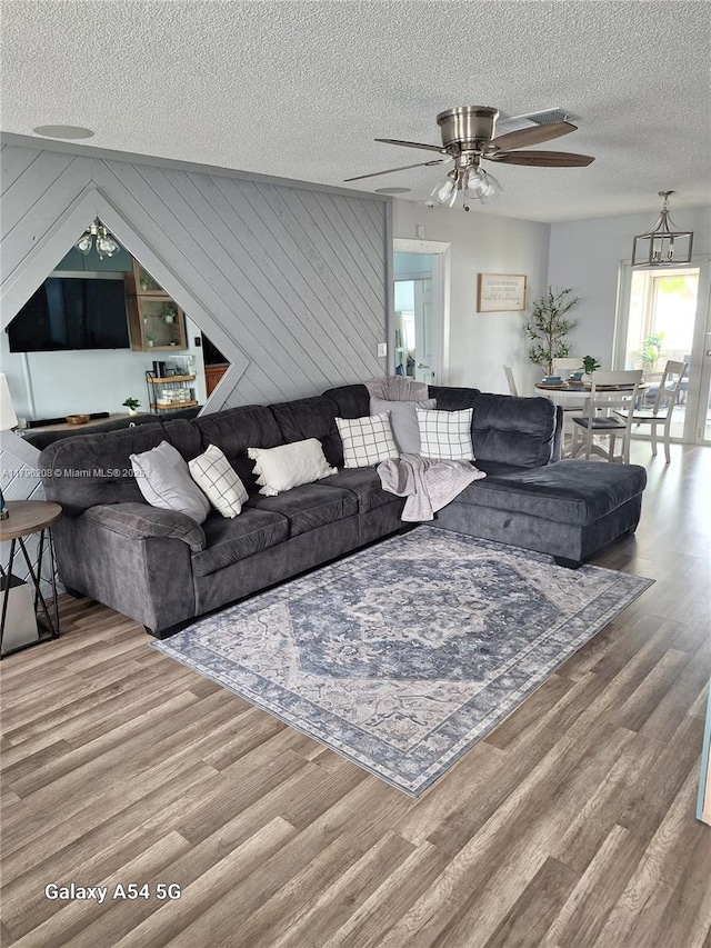 423 SW 80th Ave, North Lauderdale, FL 33068 - living area with wood finished floors, ceiling fan, and a textured ceiling