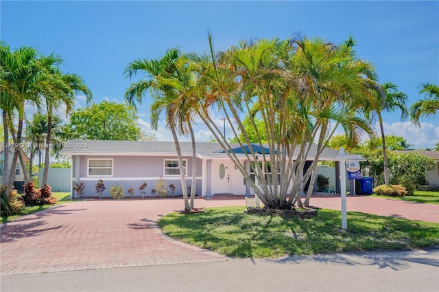 717 E River Dr, Margate, FL 33063 - ranch-style house featuring decorative driveway and stucco siding