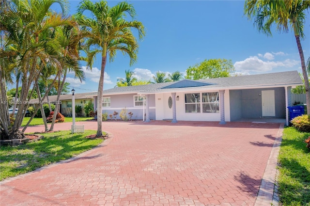 717 E River Dr, Margate, FL 33063 - ranch-style home with decorative driveway and stucco siding