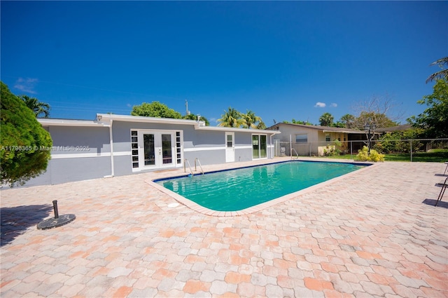 717 E River Dr, Margate, FL 33063 - view of swimming pool with french doors and a patio area