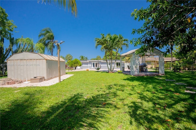717 E River Dr, Margate, FL 33063 - view of grassy yard featuring a gazebo and an outdoor structure