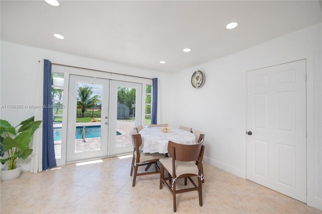 717 E River Dr, Margate, FL 33063 - dining space with french doors, recessed lighting, and light tile patterned floors