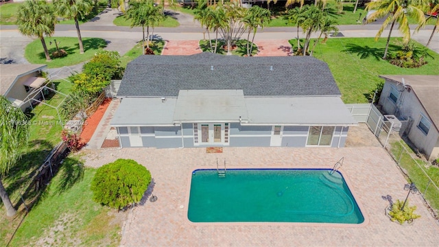 717 E River Dr, Margate, FL 33063 - outdoor pool with a fenced backyard, a patio area, and french doors