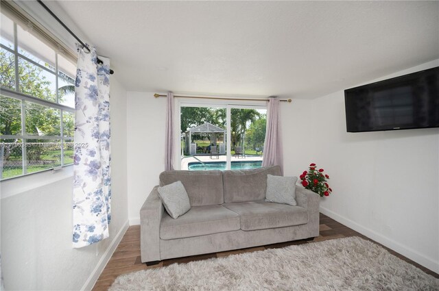 717 E River Dr, Margate, FL 33063 - living room featuring wood finished floors and baseboards