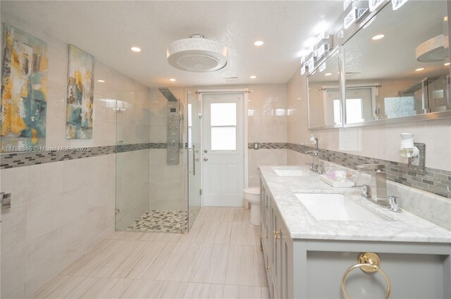 717 E River Dr, Margate, FL 33063 - bathroom with a shower stall, double vanity, tile patterned flooring, recessed lighting, and toilet