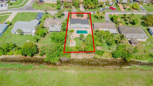 717 E River Dr, Margate, FL 33063 - aerial view of residential area featuring a pool and property boundaries highlighted