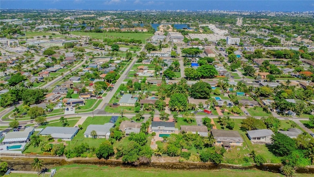 717 E River Dr, Margate, FL 33063 - aerial view of property and surrounding area with nearby suburban area