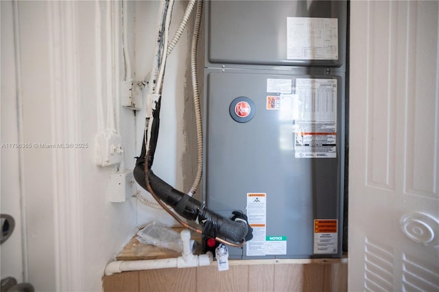 717 E River Dr, Margate, FL 33063 - utility room featuring heating unit