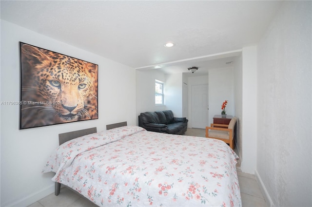 717 E River Dr, Margate, FL 33063 - bedroom with baseboards, light tile patterned floors, and recessed lighting
