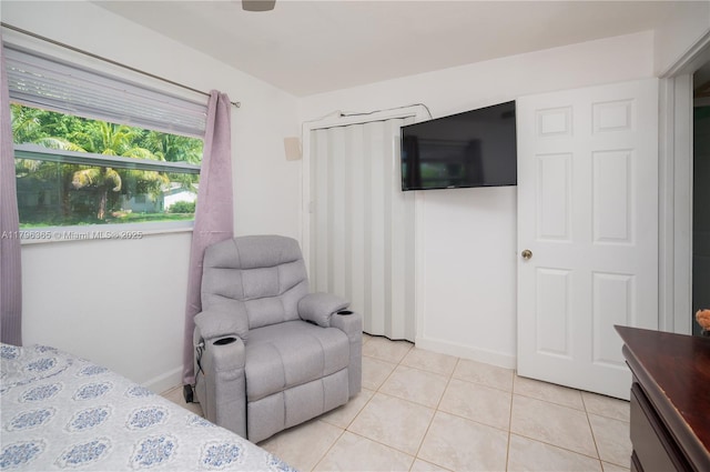 717 E River Dr, Margate, FL 33063 - bedroom with light tile patterned floors and baseboards
