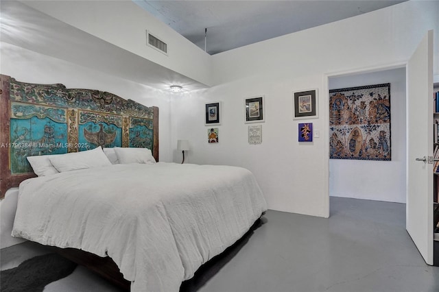 bedroom featuring visible vents and finished concrete flooring