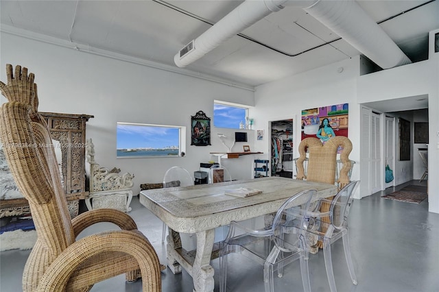 dining area featuring finished concrete floors