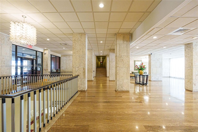 1980 S Ocean Dr Unit Mk, Hallandale Beach, FL 33009 - corridor featuring an inviting chandelier, wood finished floors, and visible vents