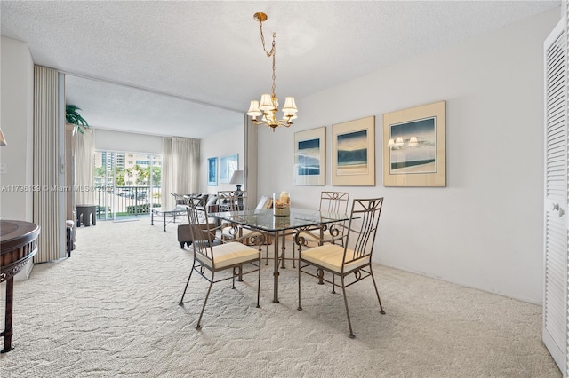 1980 S Ocean Dr Unit Mk, Hallandale Beach, FL 33009 - dining space with carpet floors, a textured ceiling, and an inviting chandelier
