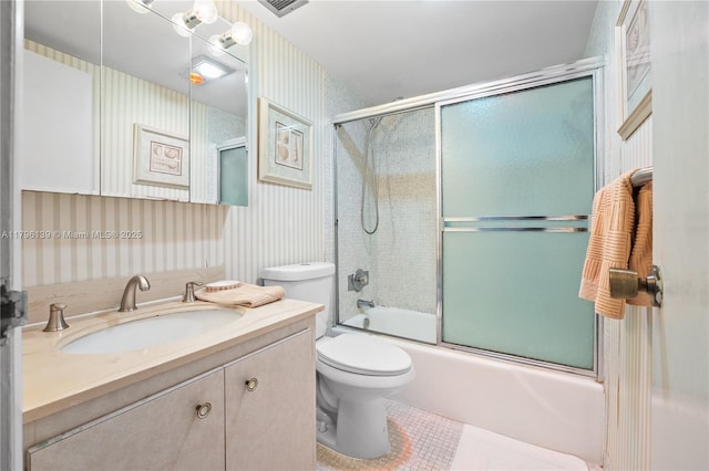 1980 S Ocean Dr Unit Mk, Hallandale Beach, FL 33009 - full bathroom with tile patterned flooring, vanity, toilet, wallpapered walls, and bath / shower combo with glass door