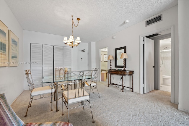 1980 S Ocean Dr Unit Mk, Hallandale Beach, FL 33009 - carpeted dining area with a textured ceiling, a notable chandelier, and visible vents