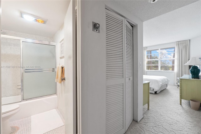 1980 S Ocean Dr Unit Mk, Hallandale Beach, FL 33009 - hallway featuring a textured ceiling and carpet