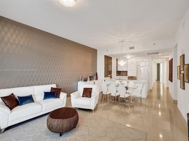 living area featuring wallpapered walls
