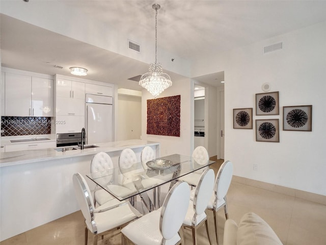 dining area featuring a chandelier