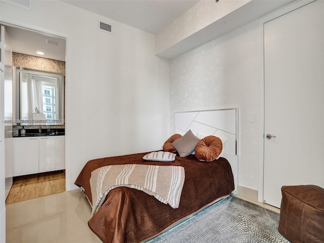 bedroom featuring a sink