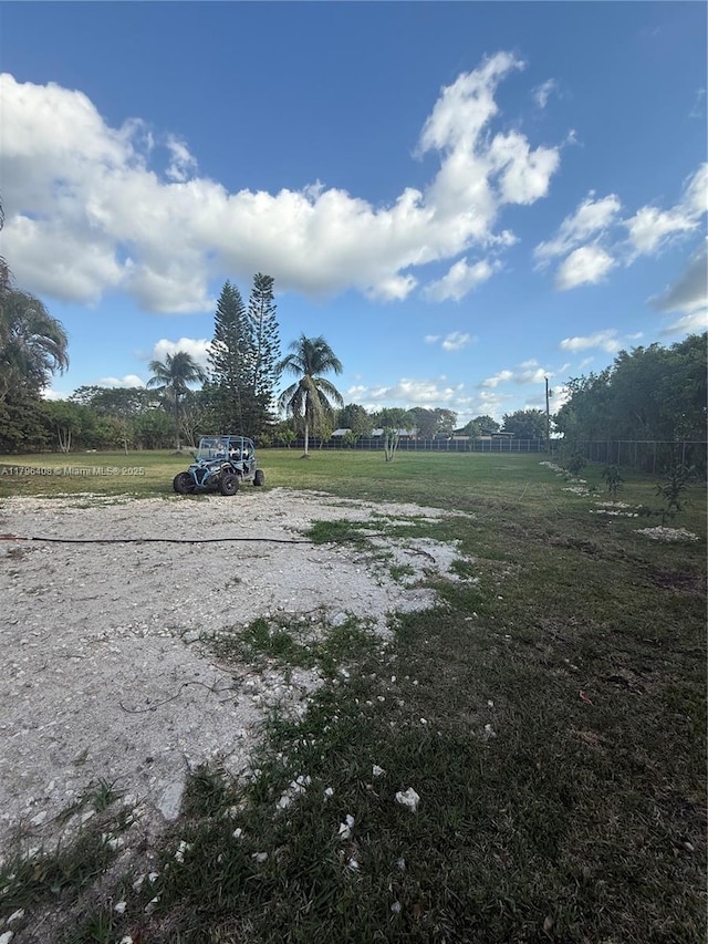 view of yard with a rural view