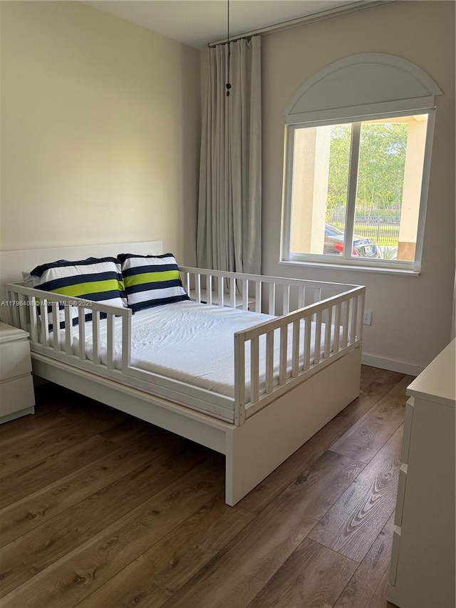 bedroom featuring wood finished floors