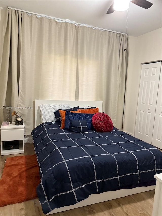 bedroom featuring ceiling fan and wood finished floors