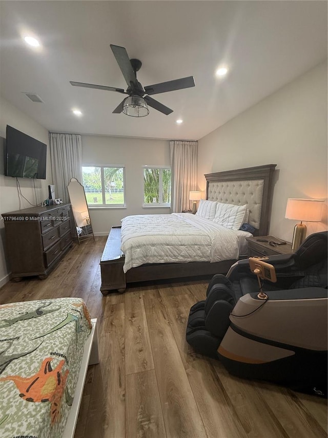 bedroom with visible vents, wood finished floors, baseboards, recessed lighting, and a ceiling fan