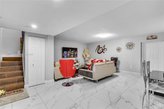 5061 W 12th Ln Unit E-10, Hialeah, FL 33012 - living room with baseboards, marble finish floor, and stairs