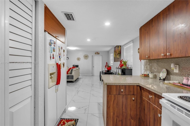 5061 W 12th Ln Unit E-10, Hialeah, FL 33012 - kitchen featuring white appliances, light countertops, marble finish floor, recessed lighting, and visible vents