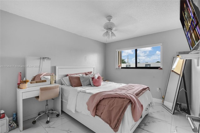 5061 W 12th Ln Unit E-10, Hialeah, FL 33012 - bedroom featuring a ceiling fan, a textured ceiling, and marble finish floor