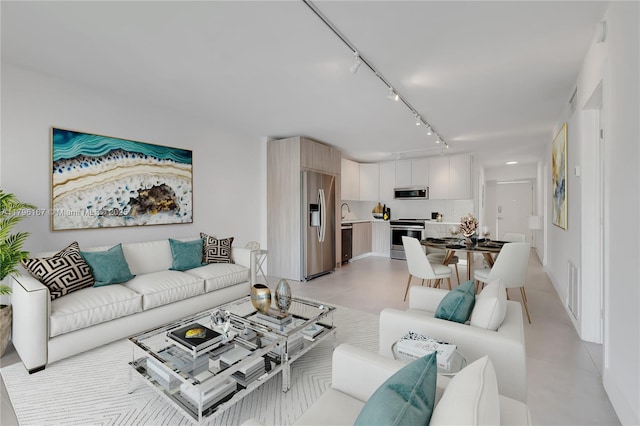 240 Galen Dr Unit 308, Key Biscayne, FL 33149 - living area featuring rail lighting and concrete flooring