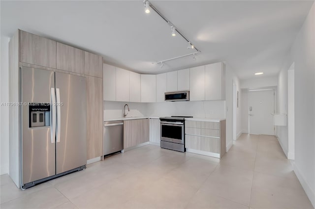 240 Galen Dr Unit 308, Key Biscayne, FL 33149 - kitchen featuring modern cabinets, light countertops, stainless steel appliances, and a sink