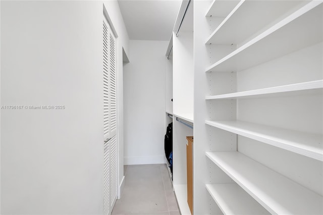 240 Galen Dr Unit 308, Key Biscayne, FL 33149 - spacious closet featuring light tile patterned floors