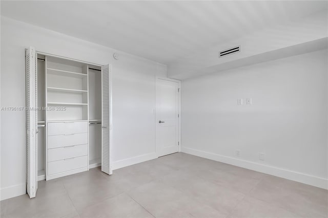 240 Galen Dr Unit 308, Key Biscayne, FL 33149 - unfurnished bedroom with baseboards, a closet, and visible vents
