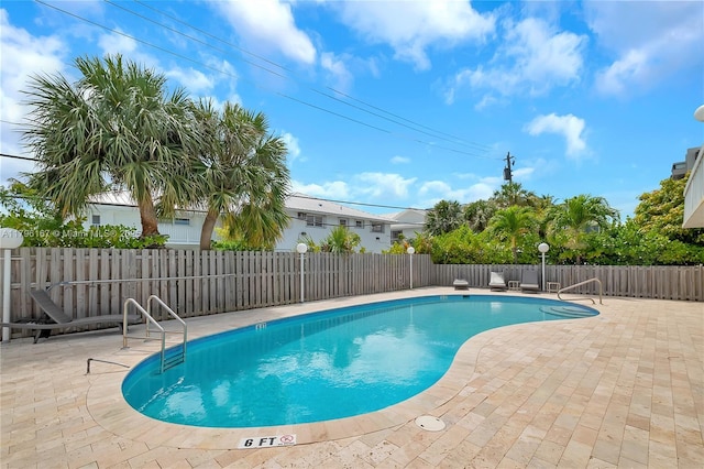 240 Galen Dr Unit 308, Key Biscayne, FL 33149 - view of swimming pool featuring a patio area, a fenced in pool, and fence