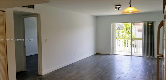 15205 NE 6th Ave Unit D204, Miami, FL 33162 - spare room with dark wood-type flooring, baseboards, and visible vents