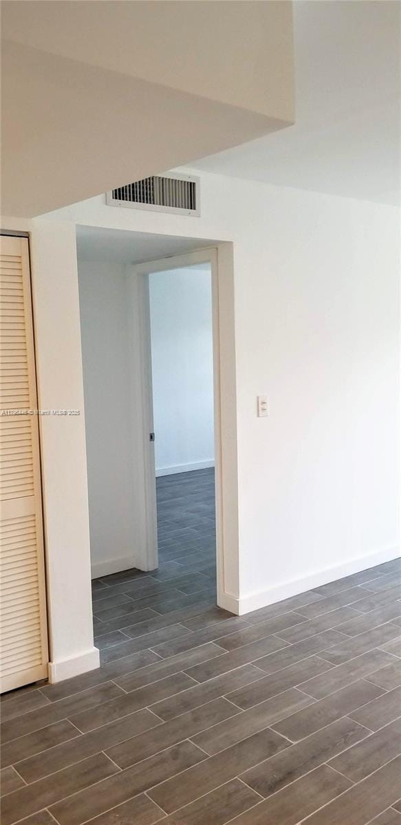 15205 NE 6th Ave Unit D204, Miami, FL 33162 - empty room with visible vents, baseboards, and wood finish floors