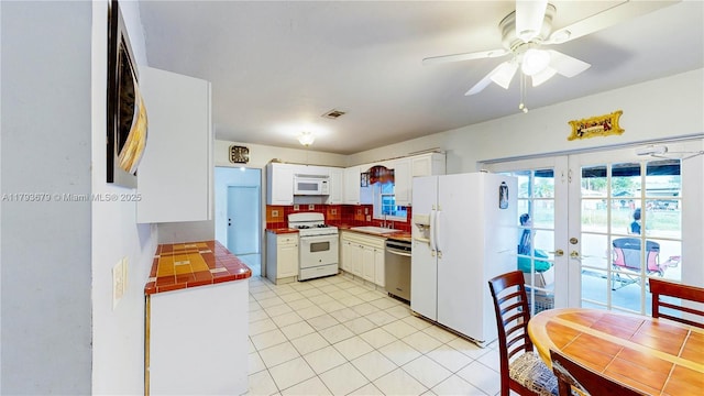 18231 SW 90th Ct, Palmetto Bay, FL 33157 - kitchen featuring a sink, white appliances, french doors, a ceiling fan, and tile counters