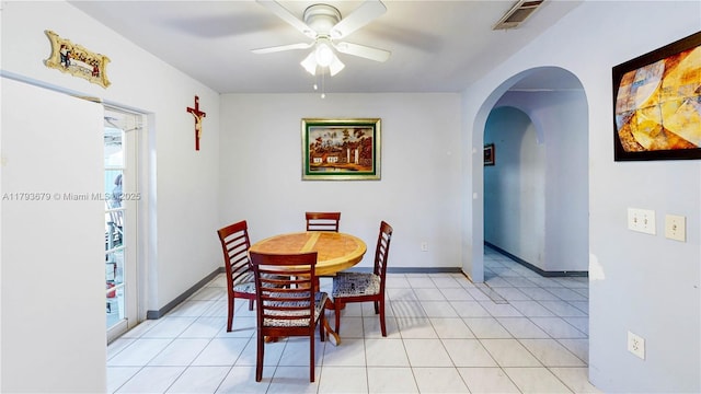 18231 SW 90th Ct, Palmetto Bay, FL 33157 - dining area with arched walkways, ceiling fan, baseboards, and visible vents