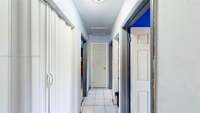 18231 SW 90th Ct, Palmetto Bay, FL 33157 - hallway with attic access and light tile patterned flooring