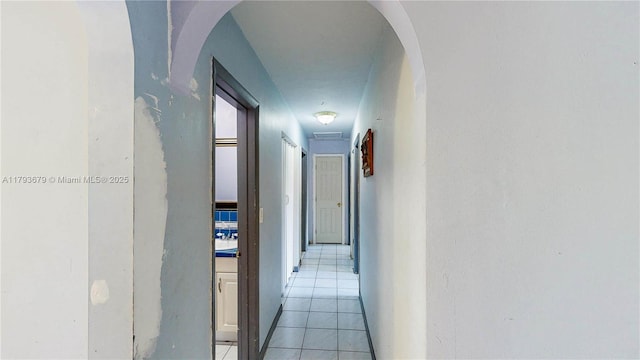 18231 SW 90th Ct, Palmetto Bay, FL 33157 - hallway featuring light tile patterned floors and arched walkways