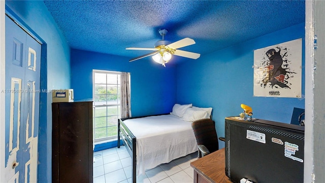 18231 SW 90th Ct, Palmetto Bay, FL 33157 - tiled bedroom with ceiling fan and a textured ceiling