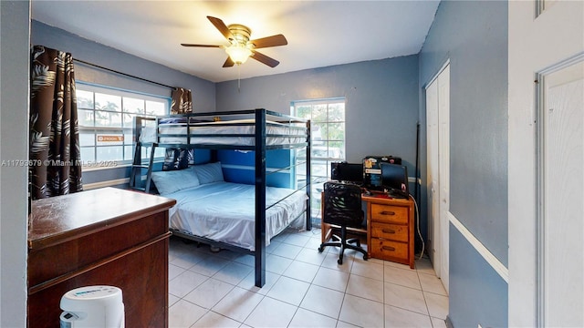 18231 SW 90th Ct, Palmetto Bay, FL 33157 - bedroom featuring multiple windows, ceiling fan, and light tile patterned flooring