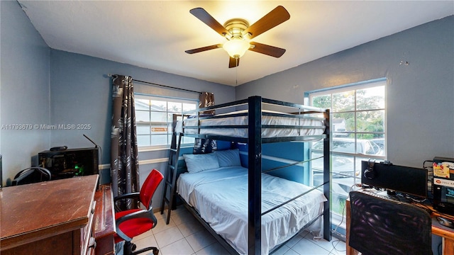 18231 SW 90th Ct, Palmetto Bay, FL 33157 - bedroom with multiple windows, light tile patterned floors, and ceiling fan