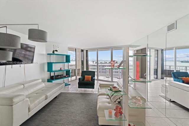 4000 Towerside Ter Unit 704, Miami, FL 33138 - living room featuring a wall of windows, tile patterned flooring, and visible vents