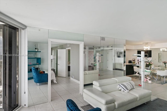 4000 Towerside Ter Unit 704, Miami, FL 33138 - living room with an inviting chandelier, visible vents, and light tile patterned flooring