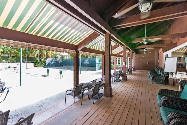 4000 Towerside Ter Unit 704, Miami, FL 33138 - wooden terrace featuring outdoor dining area, fence, and a ceiling fan
